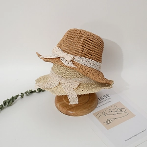 Breathable hand-woven hollow straw hat for girls with delicate white lace bow