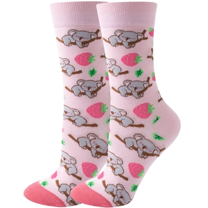 Detail of pink crew socks featuring cute koala and strawberry cartoon patterns for women