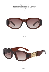 Detail of vintage brown sunglasses with wide gold circular metal embossed temples