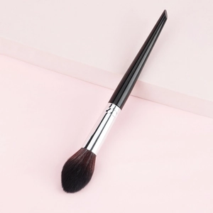 Fluffy powder and blush brush with black handle and silver ferrule for professional makeup