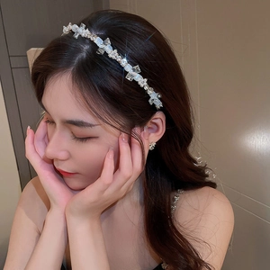 Elegant floral headband with pearls and rhinestones on silver frame for women