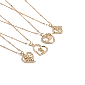 Detail of four gold-plated necklaces with heart pendants and crystal zircon stones