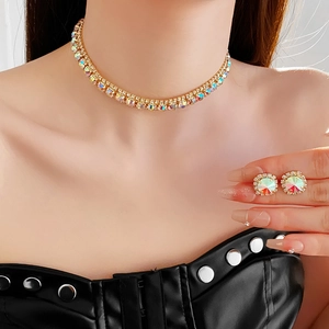 Macro shot of colorful rhinestone choker necklace and matching stud earrings on model