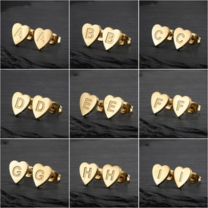 Detailed grid view of golden heart-shaped initial earrings from letters A to I