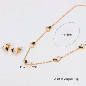 Elegant two-tone heart necklace and earrings set in stainless steel with black and white finish