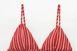 Detailed close-up of red and white striped camisole top showing fabric texture and straps