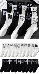 Detailed view of mid-calf monster graffiti socks with street style patterns in sizes 37-46