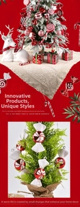 Close-up of red and white striped candy cane ornaments hanging on a Christmas tree branch