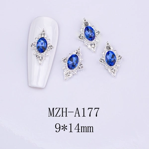 Blue sapphire oval nail charms with silver metal frame and tiny white crystals detail