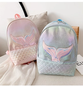 Macro detail of laser mermaid backpack featuring fish scale texture and embroidery