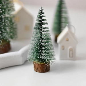Miniature frosted Christmas tree with natural wood base for Nordic tabletop decoration