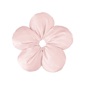 Detail of pink silk flower scrunchie showing smooth fabric texture and five petals