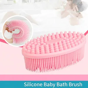 Pink silicone baby bath brush with soft cleaning bristles and massage side for sensory use