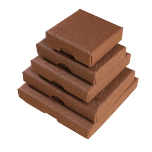 Brown textured gift boxes for jewelry in multiple sizes shown in a stacked pyramid layout
