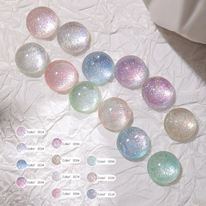 Detail showing colorful glitter resin nail charms set in eleven soft candy color shades