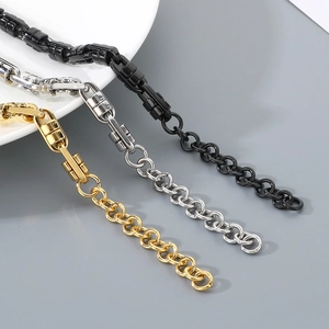 Detail of stainless steel link chains in gold silver and black with lobster clasps