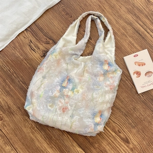 Detail of white textured tote bag with colorful tulip print and soft fluffy material