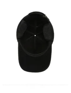 Detail view showing thickened black lining and foldable ear flaps of the wool baseball cap