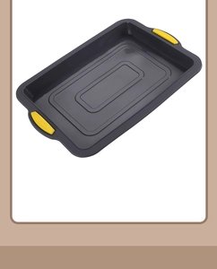 Close-up of non-stick brownie baking pan with yellow silicone handles on white background