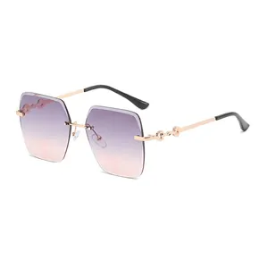 Frameless square sunglasses for women with purple gradient lenses and gold metal temples