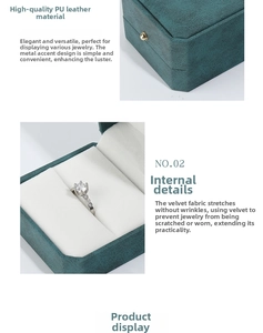 Detail of teal PU leather jewelry box with white velvet lining and gold metal clasp