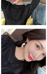 Close-up of model wearing retro multilayer round fringe drop earrings in gold and silver