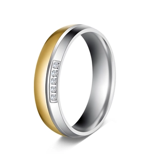 Detailed view of two-tone gold and silver stainless steel band with five inset stones