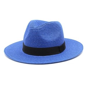 Close-up of blue straw fedora hat featuring woven texture and black ribbon band detail