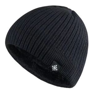 Detailed view of black ribbed knit beanie featuring thick thermal fleece lining and snowflake tag