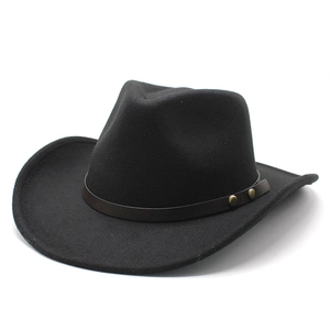 Close-up of wool felt western cowboy hat with brown leather band and gold metal studs