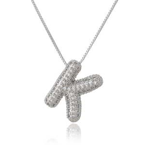 Detailed view of silver letter K pendant necklace with micro-pave cubic zirconia crystals