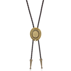 Detailed shot of bronze metal cowboy hat bolo tie with braided brown leather cord