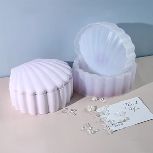 Molde de silicona con forma de concha púrpura y caja de almacenamiento con superficie texturizada