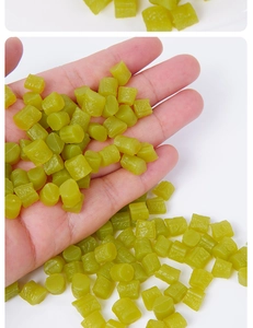 Macro shot of miniature green translucent sour beans for DIY dollhouse food scenes
