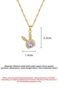 Macro shot of gold rabbit pendant featuring white micro-inlay zircon on a titanium chain