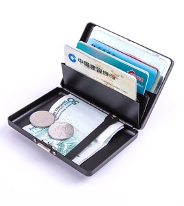 Internal view of a black aluminum card holder with accordion slots for cards and coins