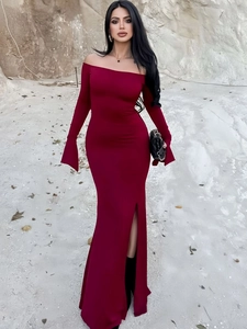 Detail view of burgundy off-shoulder dress with flared sleeves and side slit design