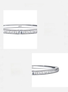Macro view of S925 sterling silver ring showing texture and square-cut zircon detail