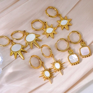 French vintage earrings with white shell pendants in 14K gold plated stainless steel finish