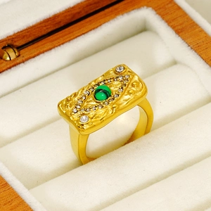 18K gold evil eye ring with green malachite and zircon stones in a wooden box