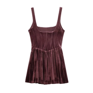 Detailed close-up of premium burgundy velvet fabric with elegant pleated textures and shine