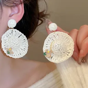 Handmade woven raffia straw hat earrings in cream white with tiny flower details