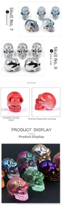 Macro detail of intricately carved crystal skulls with iridescent and plated finishes