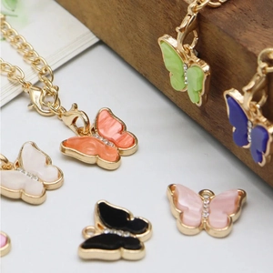 Detail showing colorful butterfly charms with gold clasp for water bottle handle