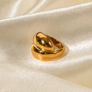 Chunky 18K gold-plated stainless steel ring with a fluid asymmetric design on silk
