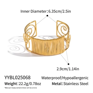Close-up of gold stainless steel mesh cuff bracelet with detailed size and weight specs