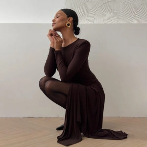 Detail of slim fit dark brown long sleeve dress with side slit and round neck design