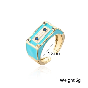Detail of blue and gold robot-style tape ring showing 1.8cm diameter and 6g weight