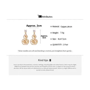 Detailed view of hollow gourd earrings with rose pattern and inlaid zircon stones
