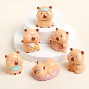 Set of 6 cute resin capybara figurines in various poses on a multi-tier display stand